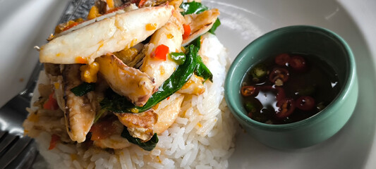 Seafood stir-fried with chilli in a rice dish. spicy seafood