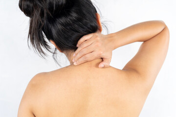 Woman rubbing aching back.