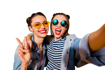 Two glad positive grinning lady stand in glasses spectacles street style stylish trendy cool casual denim jeans clothes isolated on yellow background in take picture on cellular make hollywood smile