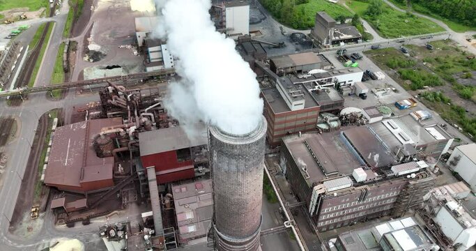 Smokestack at Chempark Krefeld Uerdingen in North Rhine Westphalia, Germany. Aerial drone view.