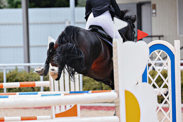 Horse Jumping, Show Jumping. to clear the obstacle. Horse hooves close-up when jumping over an...