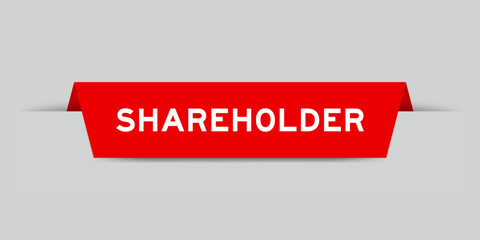Red color inserted label with word shareholder on gray background
