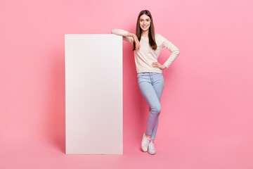 Full length body size view of beautiful trendy cheerful girl demonstrating promo copy space...