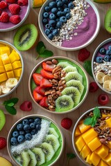 A vibrant collection of fruit bowls featuring smoothies made from berries, kiwi, and mango, beautifully garnished with nuts, seeds, and fresh fruit slices.