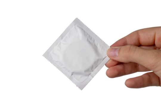 A package of white condom in a girl's hand. PNG