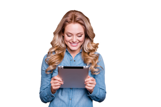 Portrait of her she nice cute winsome charming attractive cheerful glad wavy-haired lady wearing blue shirt holding in hands tablet isolated over gray pastel background