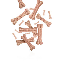 Flying and falling protein bones for dog, rawhide bone, dog biscuit against a white background. Healthy cooking concept