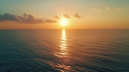 Fototapeta premium aerial view of beautiful sunset over calm sea seascape from above