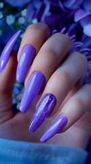 Purple stiletto nails with glitter.