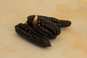 Group photo of purple corn on a table.