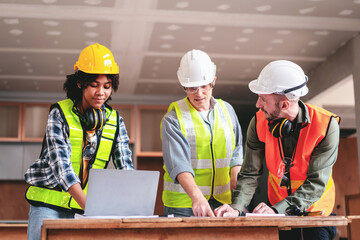 Engineer or architect team collaboration working in site discussing on blueprint building structure paperwork meeting for real estate project cooperation with partner and engineering equipment tools