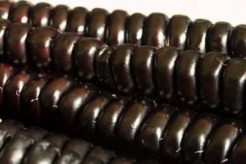 Macro photo of the texture of Peruvian purple corn. Concept of greens and vegetables.