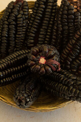 Photograph of purple corn or Peruvian black corn in a basket.