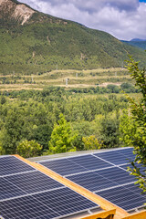 solar panels on the roof of the house in the mountains, solar home energy
