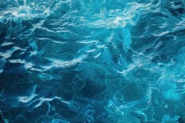 Tranquil top view of the bright turquoise ripples in clear ocean water
