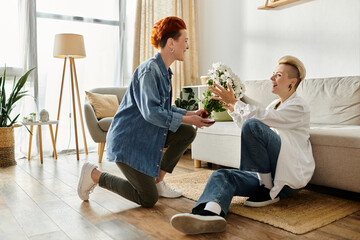 A man tenderly hands flowers to a woman in a cozy living room setting, showcasing a simple act of...