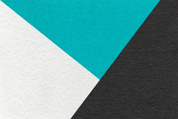 Texture of craft white, black and turquoise shade color paper background, macro. Vintage abstract cyan cardboard