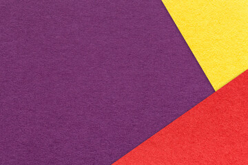 Texture of craft violet color paper background with red and yellow border. Vintage abstract purple...