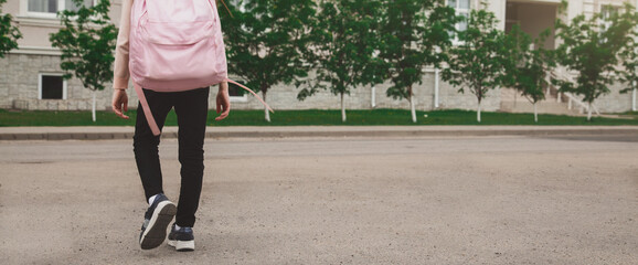Back to school. cute child girl with backpack going to school