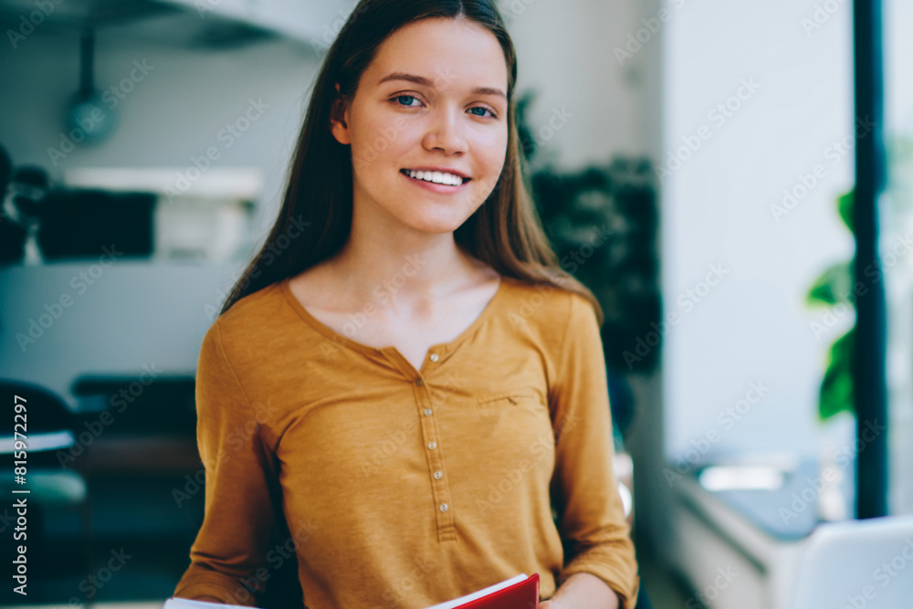 Poster happy female student studying language at coworking space searching information via netbook and prep