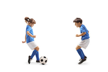 Boy and girl playing football