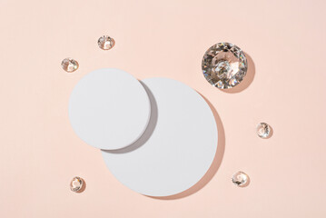 White podium with diamonds on a pink background for product presentation. Minimal concept and hard sunlight. Top view