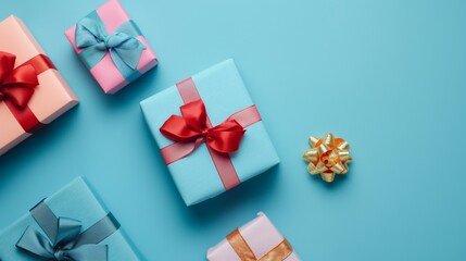 Gift boxes with ribbon neatly arrange on light background camera shot from above aerial view