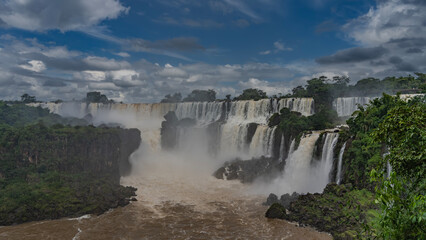 Beautiful tropical waterfall landscape. Cascading streams collapse from ledges into the bed of a...