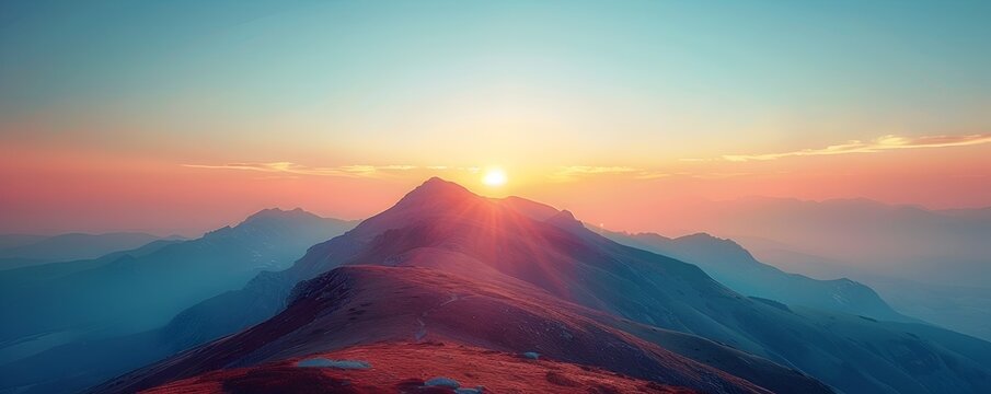 First Light Breaking Over Majestic Mountain Peaks Full of New Possibilities and Renewed Energy for the Day Ahead