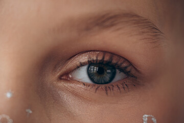 girl's eye close-up, blue eye