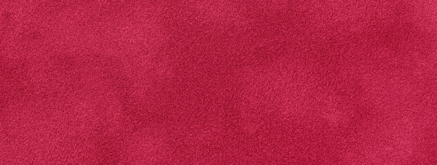 Dark red background of suede fabric material, closeup. Velvet texture of seamless wine textile, macro.