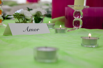 Charming wedding table markers elegantly inscribed with the word 'Love', adding a touch of romance...