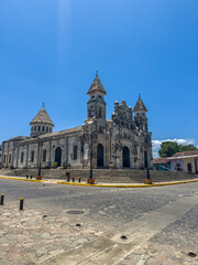 Fototapeta premium Beautiful view of the colonial city of Granada Nicaragua, Its majestic yellow cathedral, Guadalupe Church, the convent museum anda the calzada streets