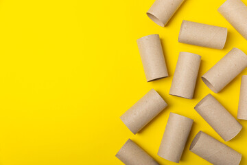 Empty toilet paper roll. Rolls of toilet paper on background. Paper tube of toilet paper. Place for...