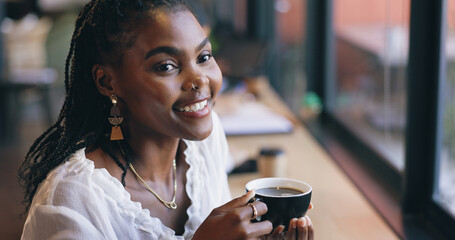 Coffee shop, happy and black woman by window with drink for relaxing, calm and breakfast in cafe....