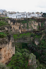 Obraz premium White-washed homes on top of a steep cliff in the village of Ronda, Andalusia, Spain.