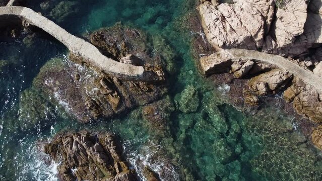 Aerial view of the broken walkway of the reefs of Rosamar. Crystal clear water at Cam&iacute; de Ronda, Santa Cristina de Aro, Costa Brava, Catalonia, Spain.