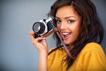Portrait, excited and woman with retro camera by studio background for shooting photo, image or...