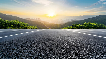 Asphalt road and green mountains with city skyline landscape at sunrise high angle view :...