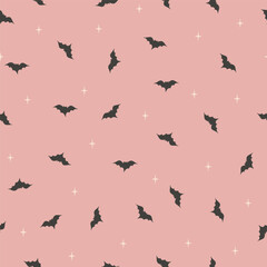 Seamless vector pattern dark gray spooky bats silhouettes on pink, halloween. Textile, scrapbook