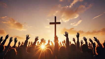 Lot of Christian worshipers raising hands up in the air for the cross in background in golden hour.