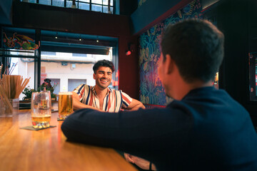 Group of people sitting at a bar