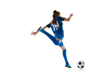 Athletic teen girl, football player in blue uniform practicing, playing isolated on white studio background. Concept of sport, active and healthy lifestyle, childhood, school, hobby