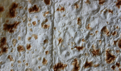 Pattern of sheet of thin pita bread for wrapping meat for shawarma or taco cooking
