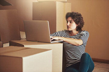 Floor, box and woman with laptop in new home for property website, real estate or mortgage plan....