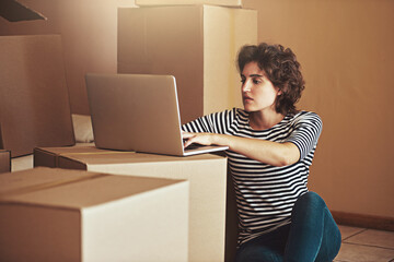 Floor, box and woman with laptop in new home for property website, real estate or mortgage plan. Internet, investment and person with technology on cardboard for house, remodeling idea or relocation