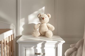crochet teddy bear , A handmade crochet teddy bear doll sits atop a white drawer commode in a cozy baby room