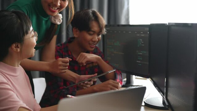 Back end software developer engineer for computer programming working together on debugging writing computing code, solving complex algorithms display on monitor in office. Burgeoning