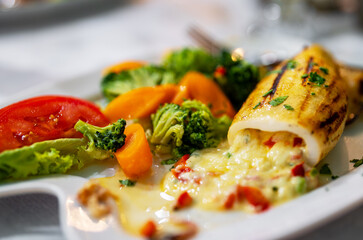 Squid stuffed with cheese and vegetables.