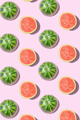 Pattern made of watermelon fruit on a pink background. Summer aesthetic background.